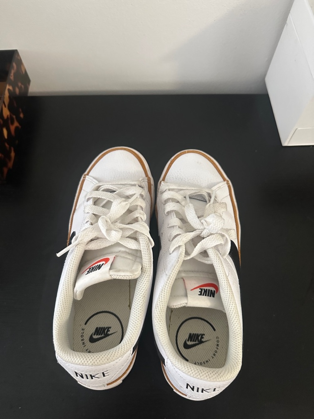 Nike White Low-Top Sneakers with Black Swoosh and Brown Trim